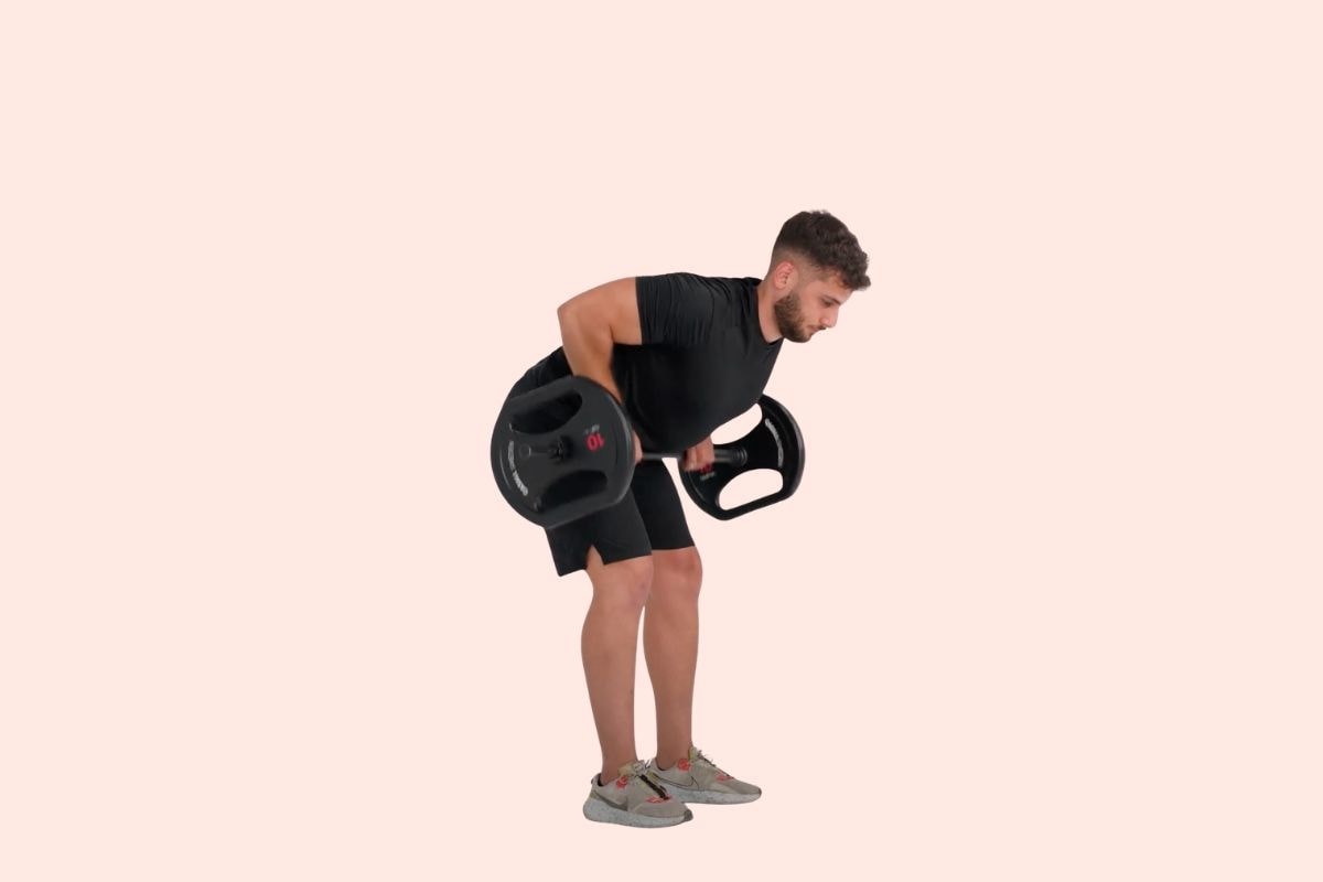 Man in black workout clothes performing bent-over rows with two weight plates.
