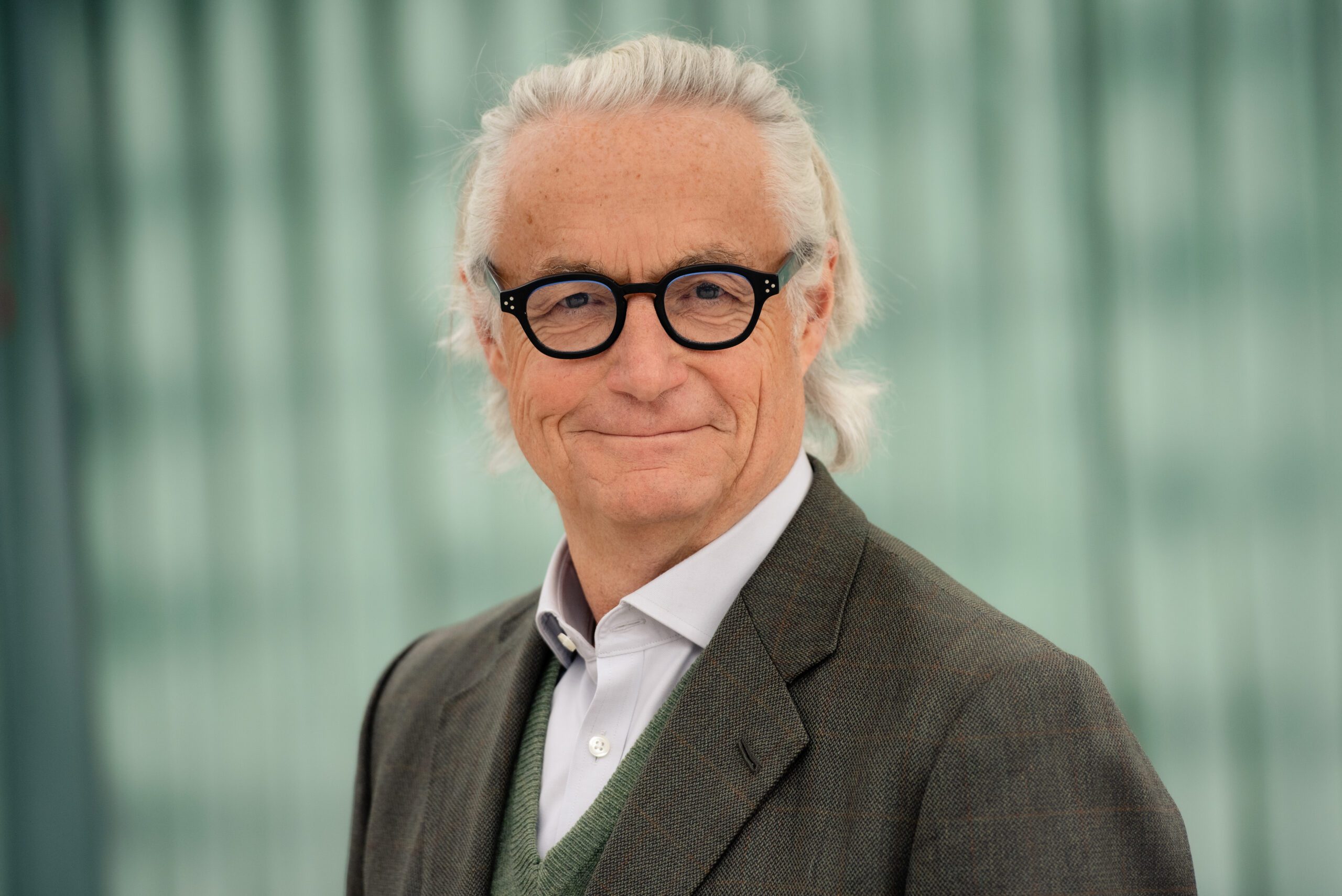 Peter Norris, Chair of the Board of Agilyx ASA, wearing glasses and a tweed jacket