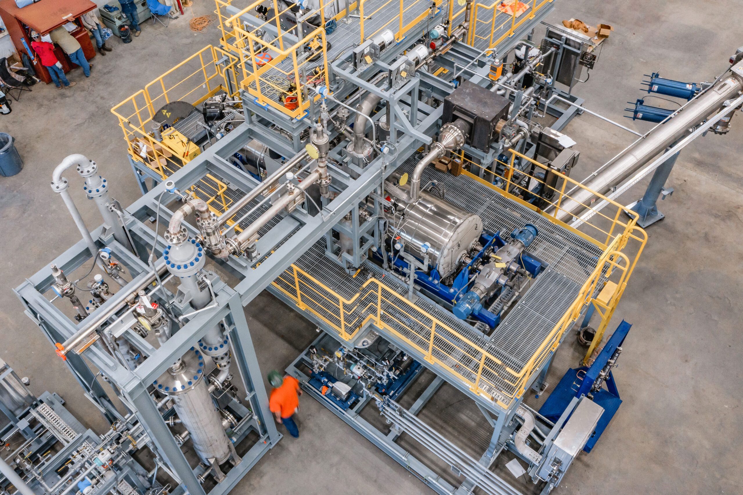 Aerial view of Agilyx's Styrenyx advanced recycling technology skid with piping and workers on site