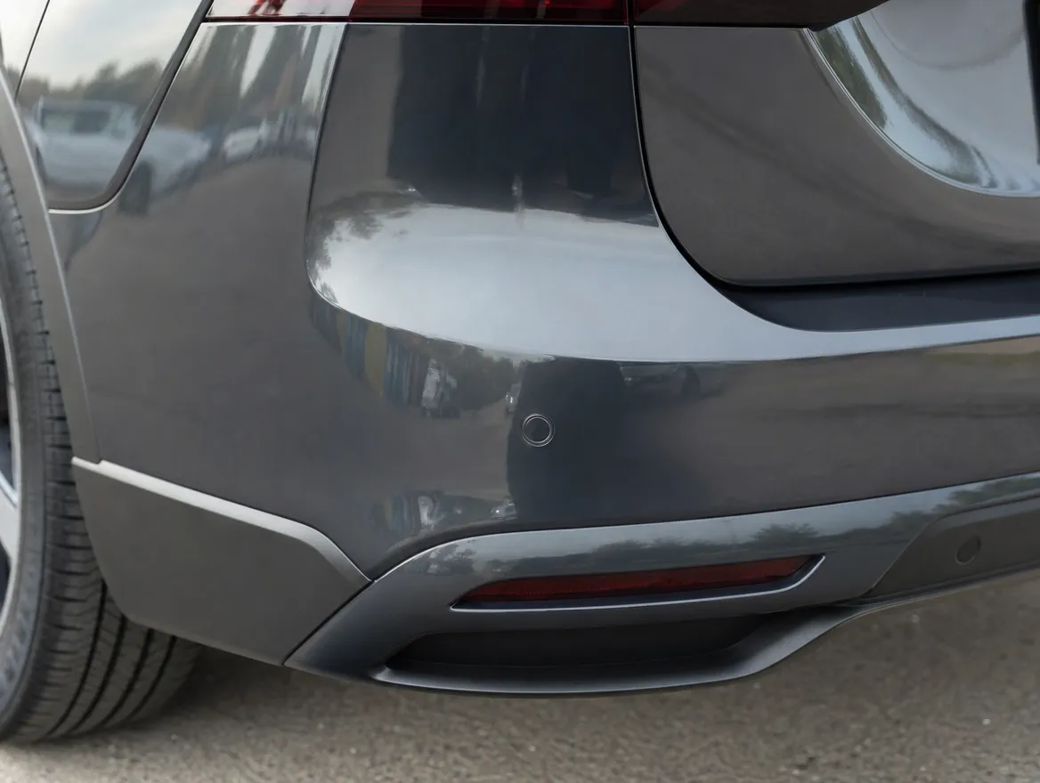 Replacement panel being fitted and aligned on a car during a bodyshop repair