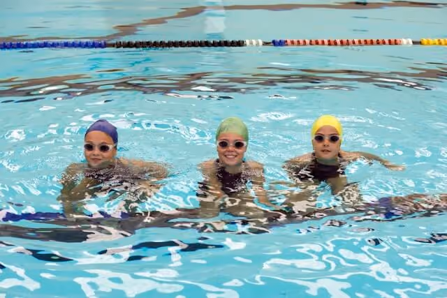 Group of kids playing in the pool.