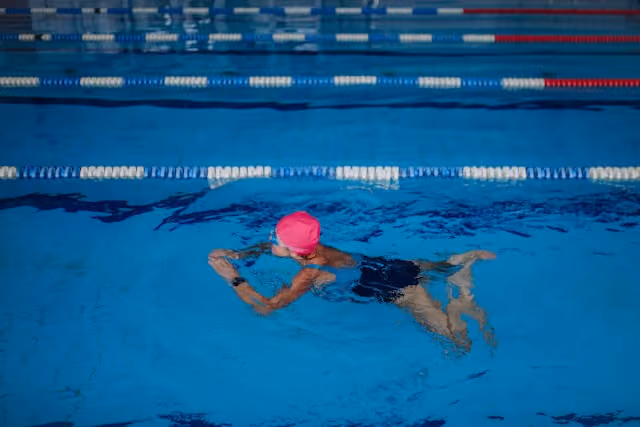 Woman swimming in the pool.
