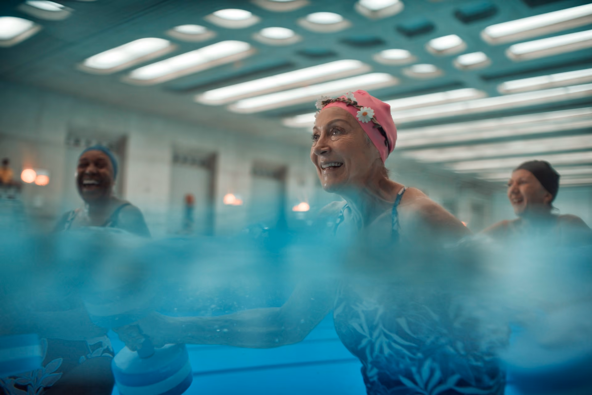 Elderly women swimming in pool.