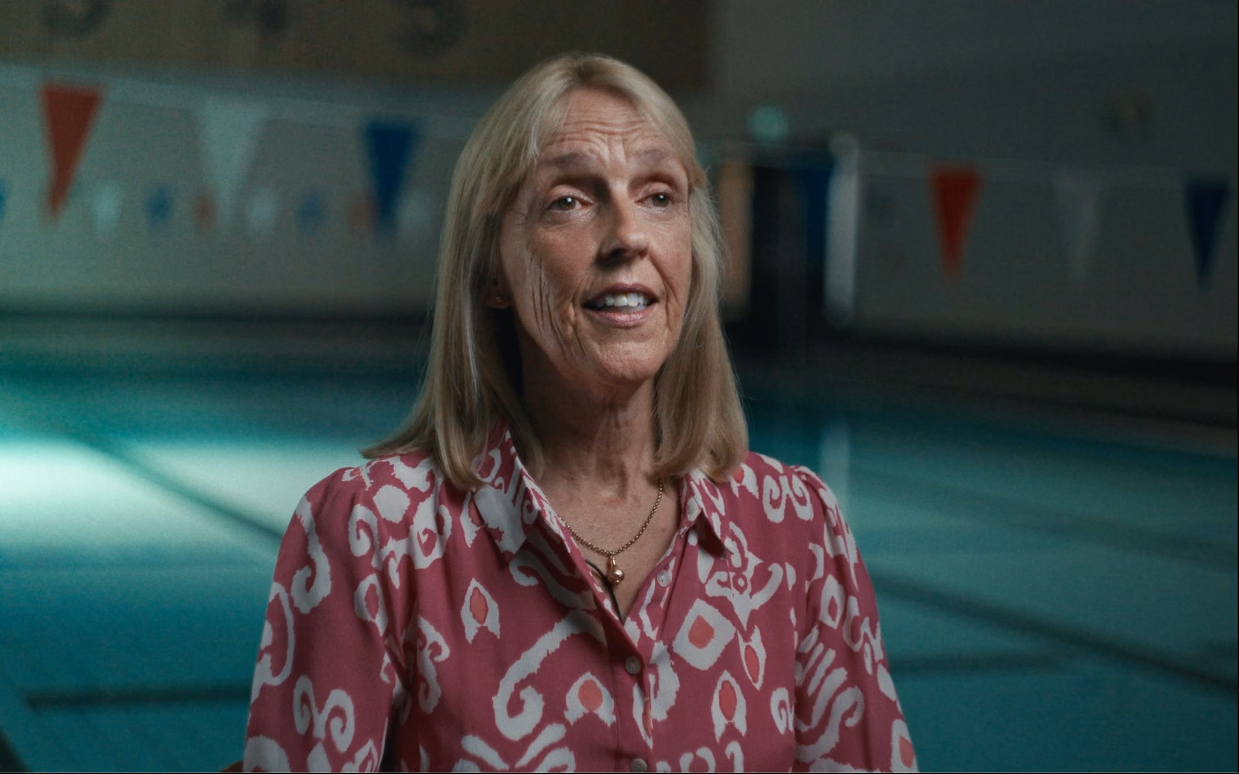 Jacqui in front of swimming pool video thumbnail.