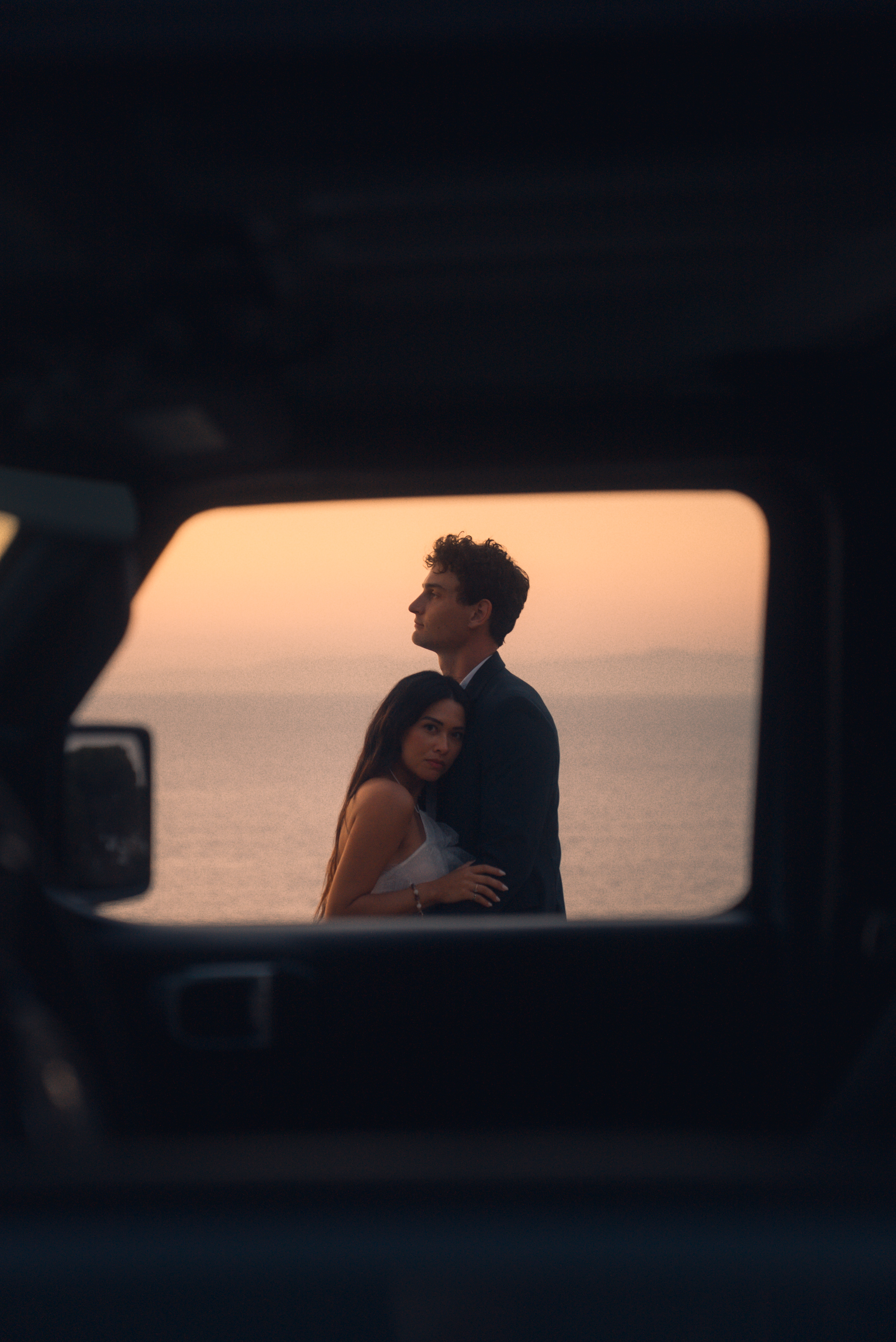 Couple standing in tall coastal grass