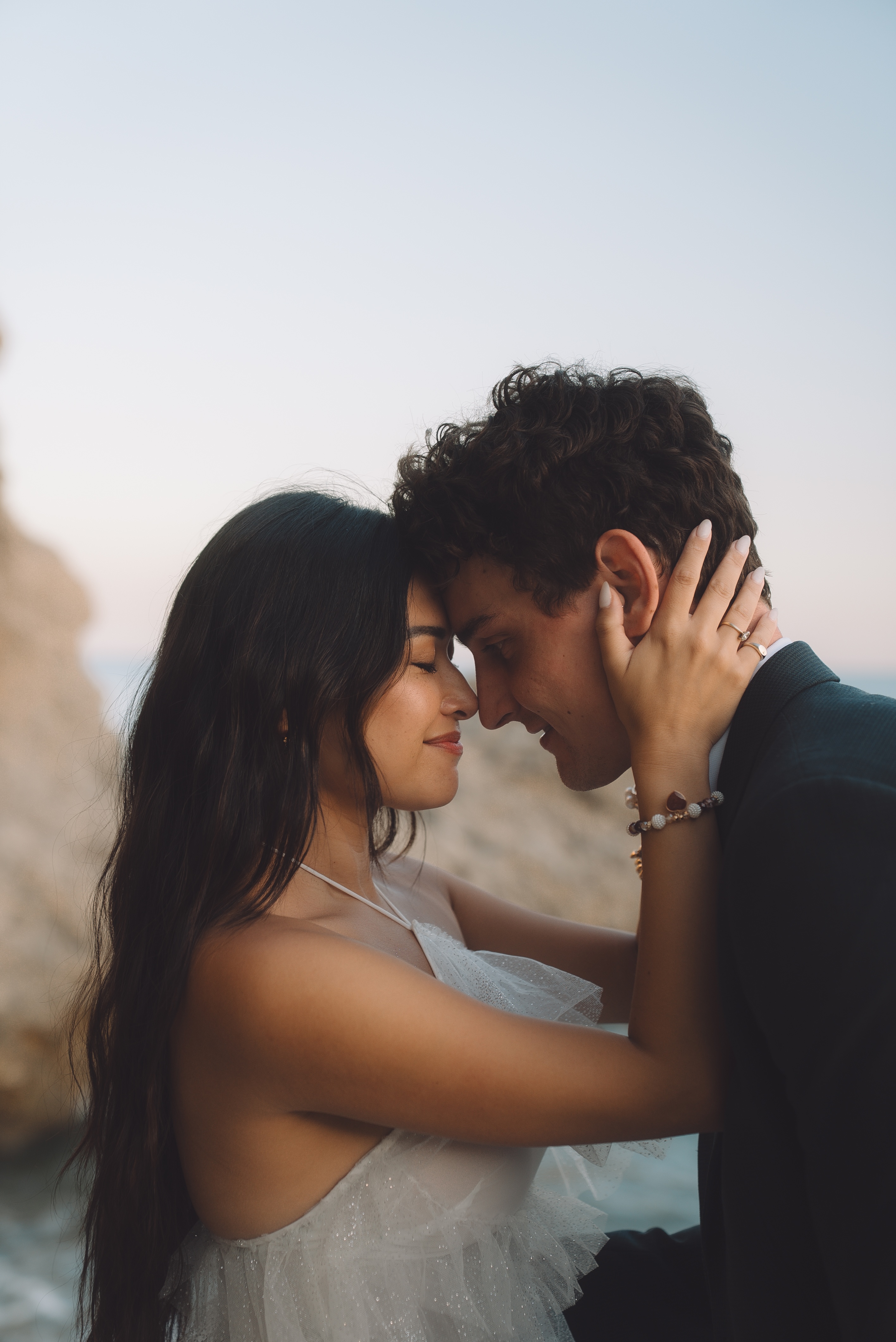 Couple touching foreheads at dusk