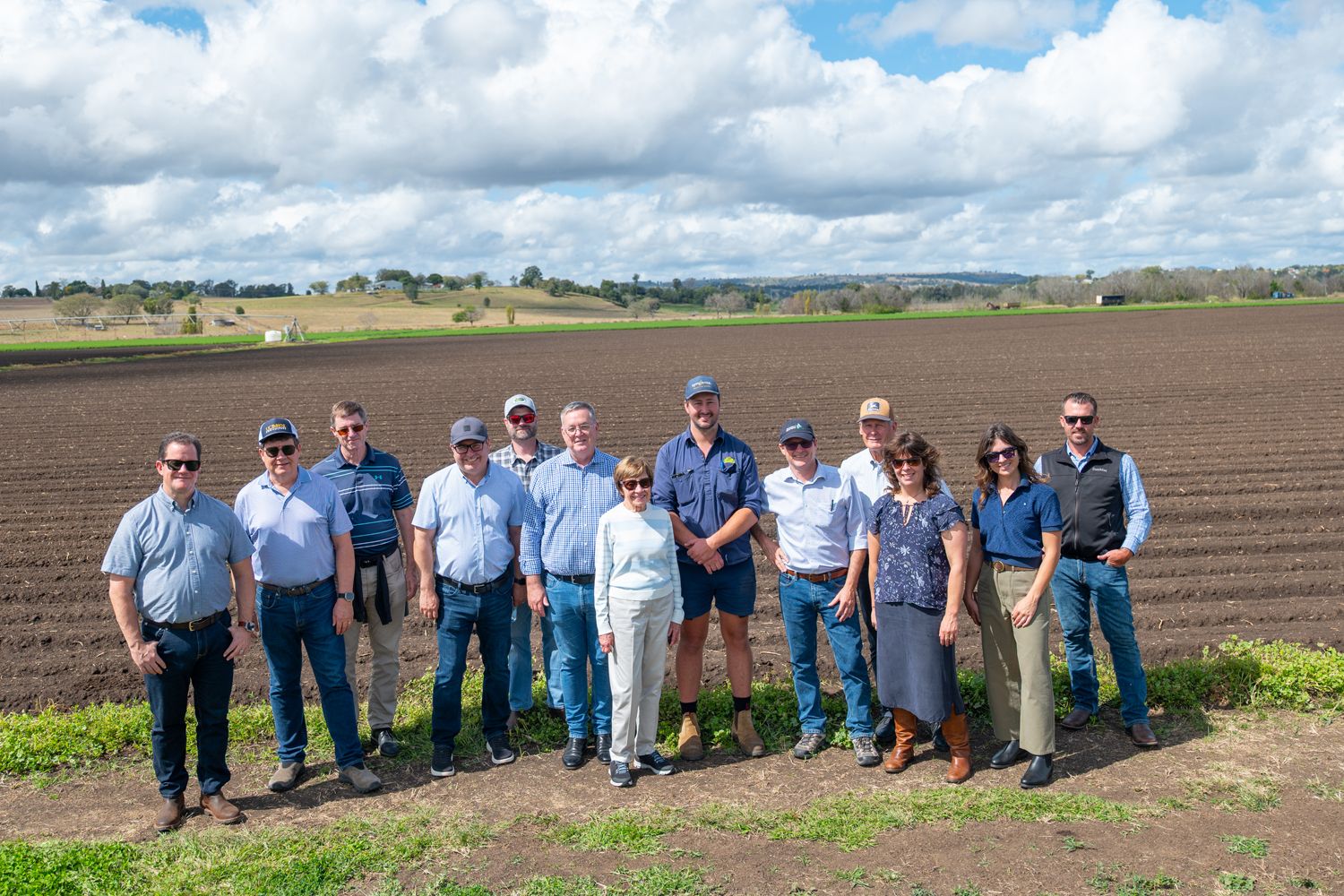 California delegation members and hosts beside a cultivated field during the visit to Kalfresh in Queensland.