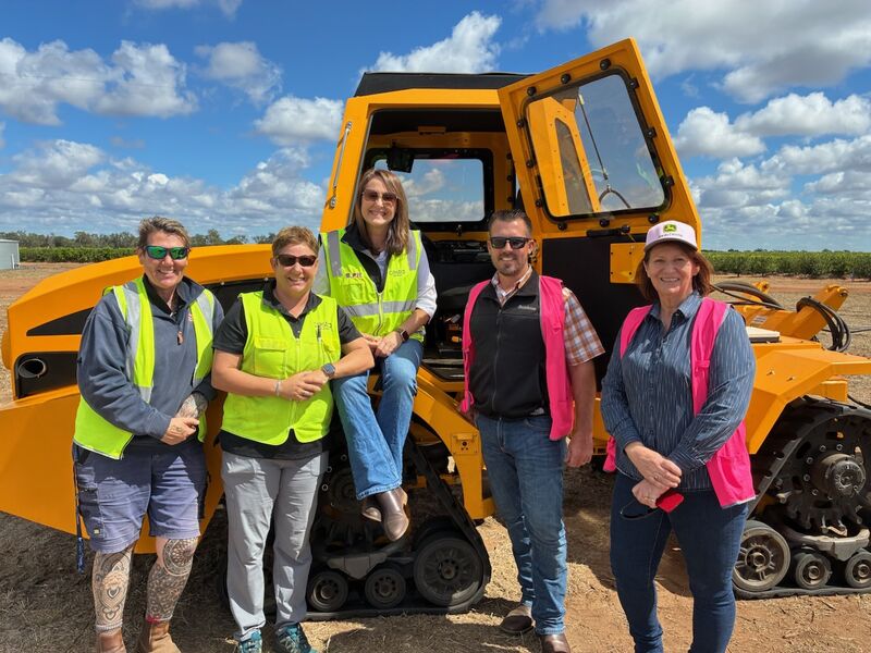 Visitors beside farm equipment during the California delegation’s Queensland visit.