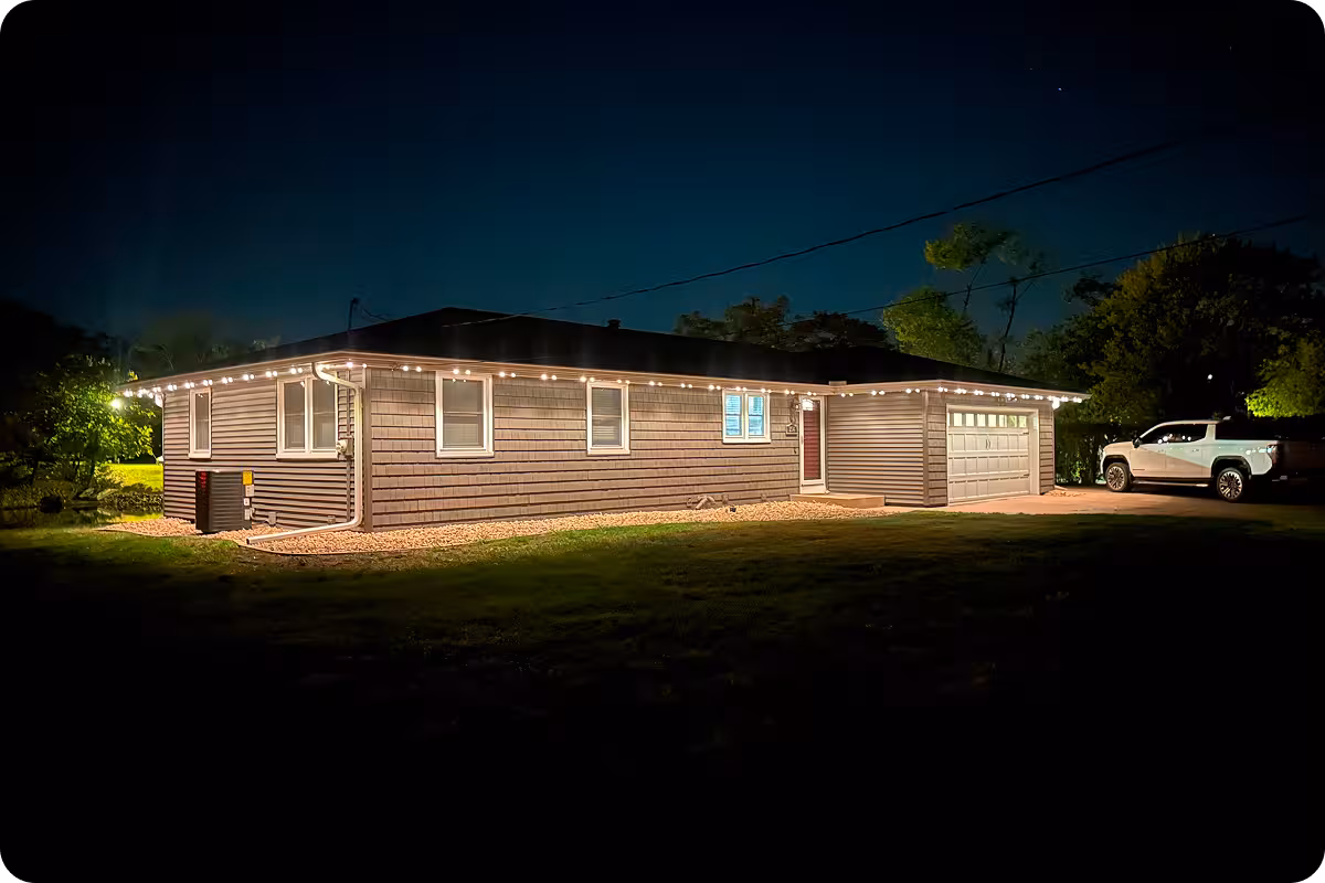 House with full wrap of white permanent lighting from Manta