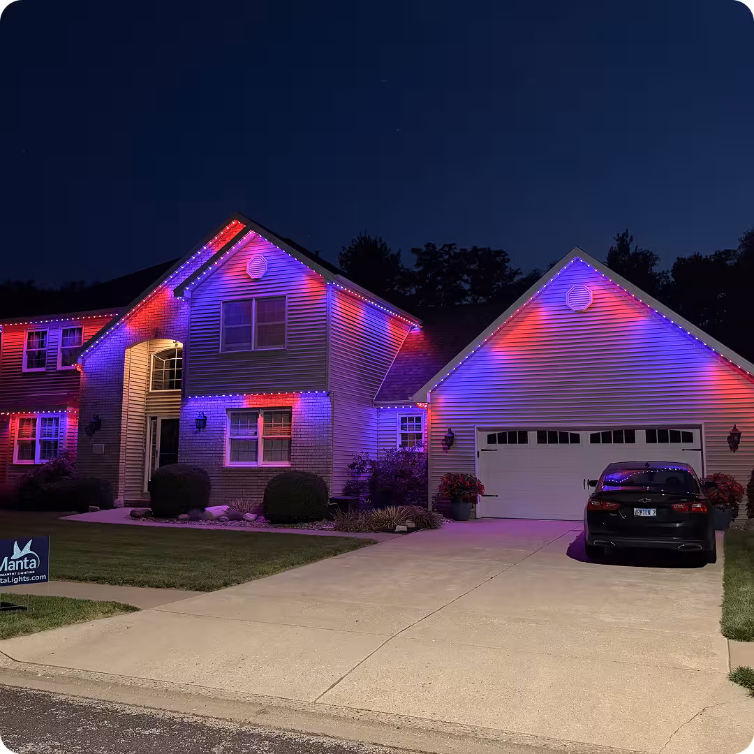 Home with red and purple bright permanent lighting installed with Manta's roofline system