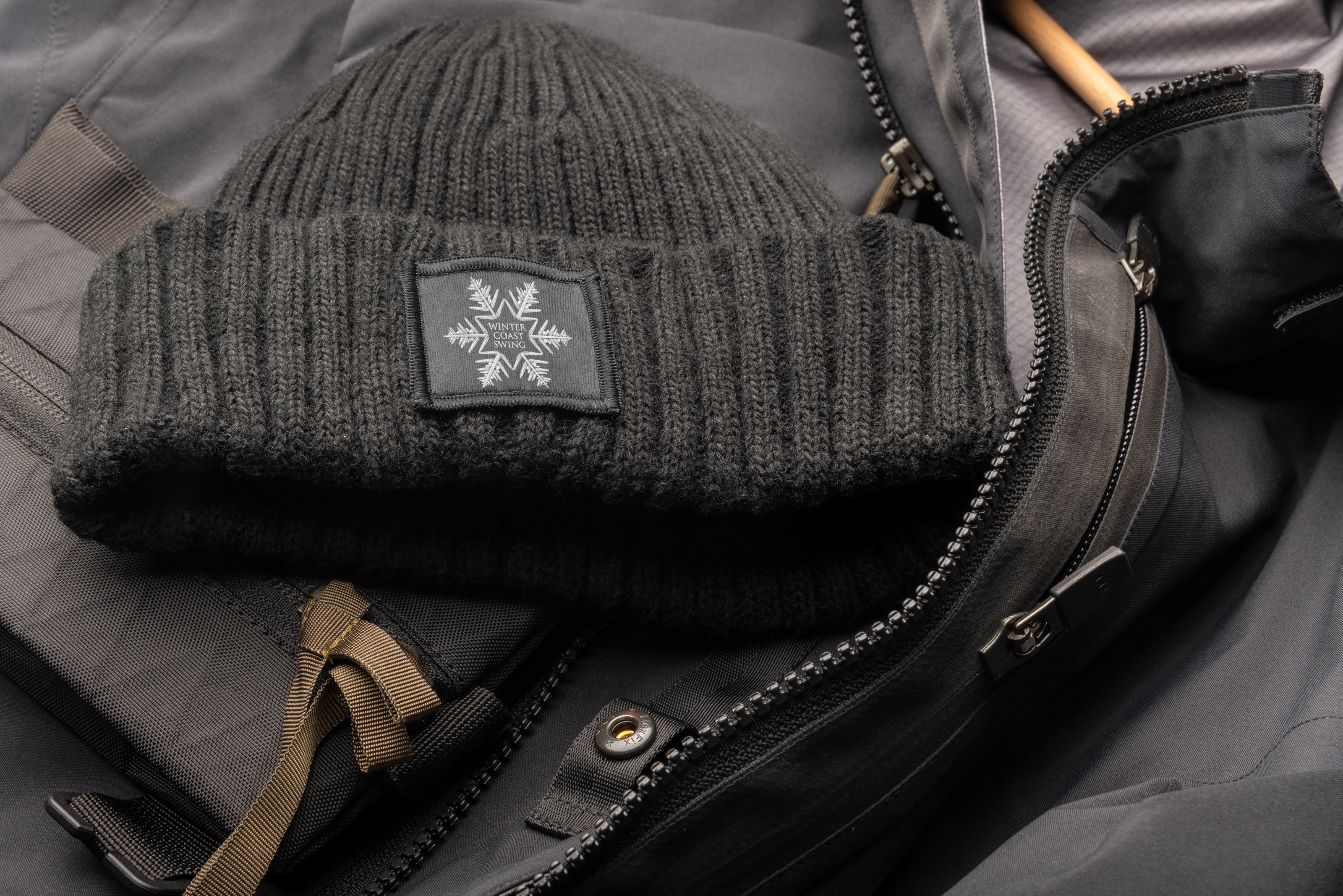 Winter Coast Swing icon woven on a beanie label