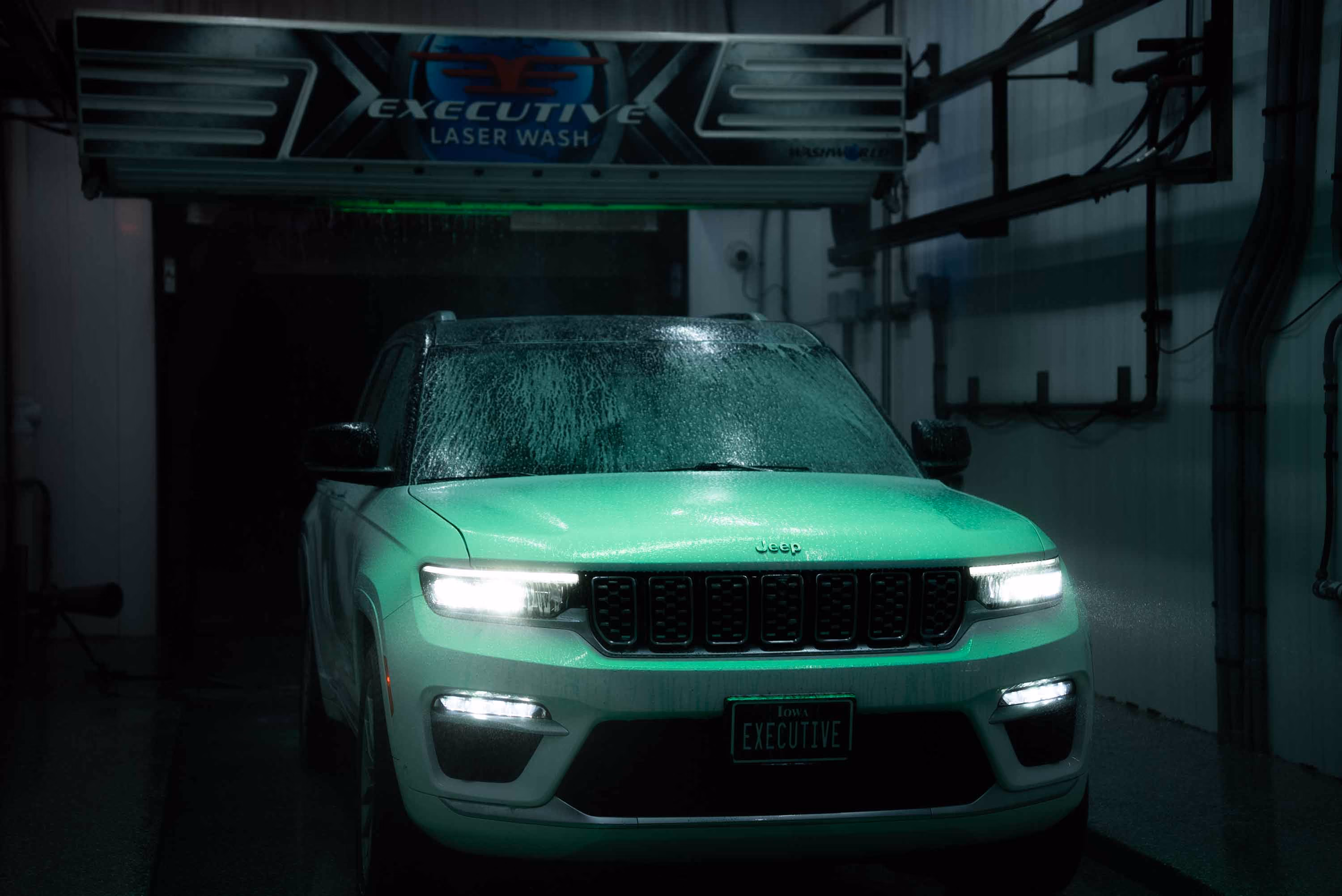 Green car in an automatic wash