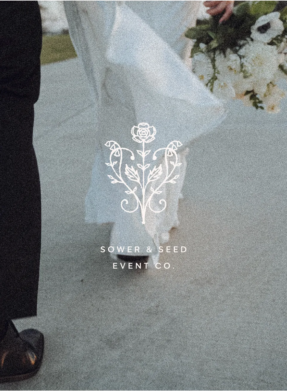 Close-up of a bride and groom walking on a paved path, the bride holding a white floral bouquet, with the logo and text 'SOWER & SEED EVENT CO.' overlayed.
