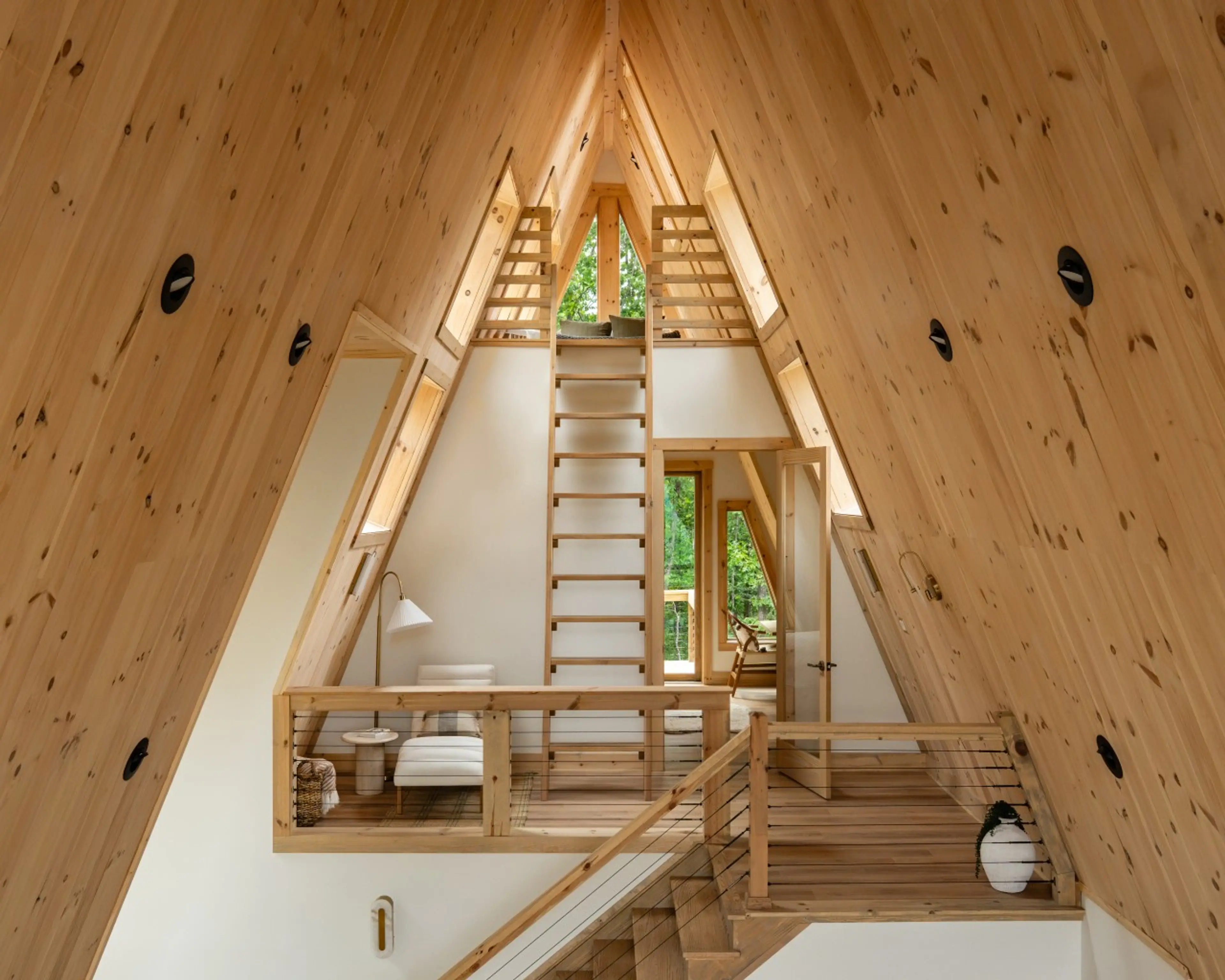 Interior staircase and loft at Solhaus Shenandoah showing the A-frame's vaulted structure