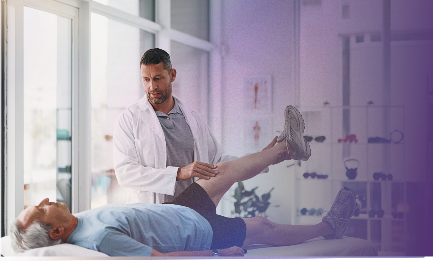 Clinician supporting a patient during musculoskeletal care