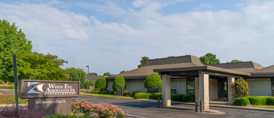 Office building and sign for White Eye Associates P.A. Ophthalmology at 301 Bowman Gray Dr.