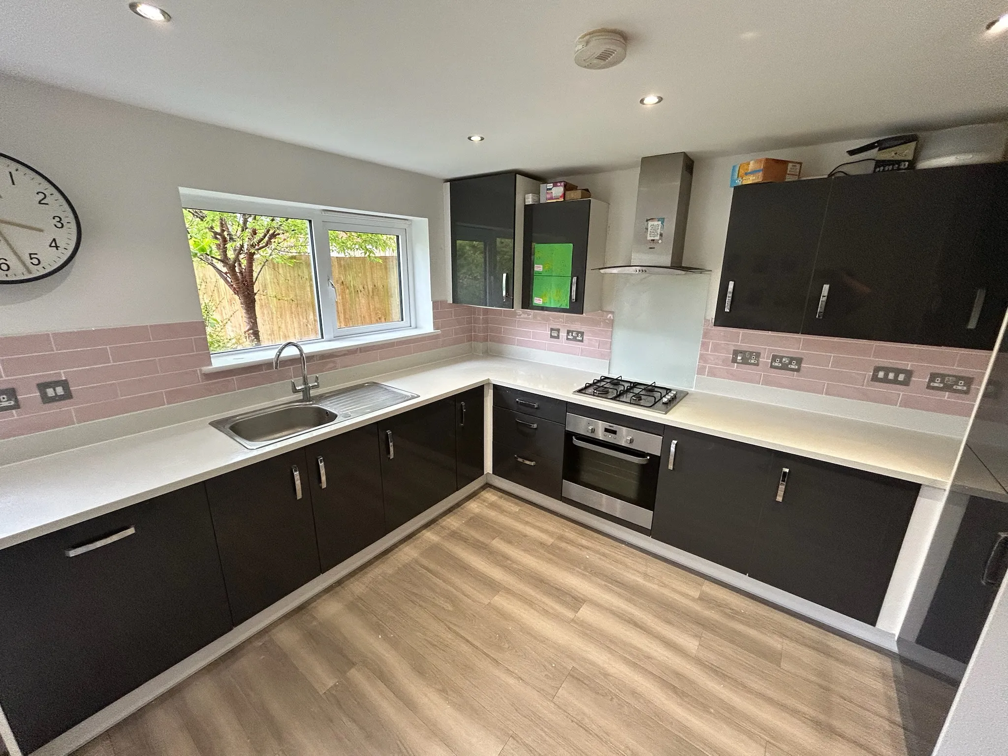 New kitchen with pink tiling