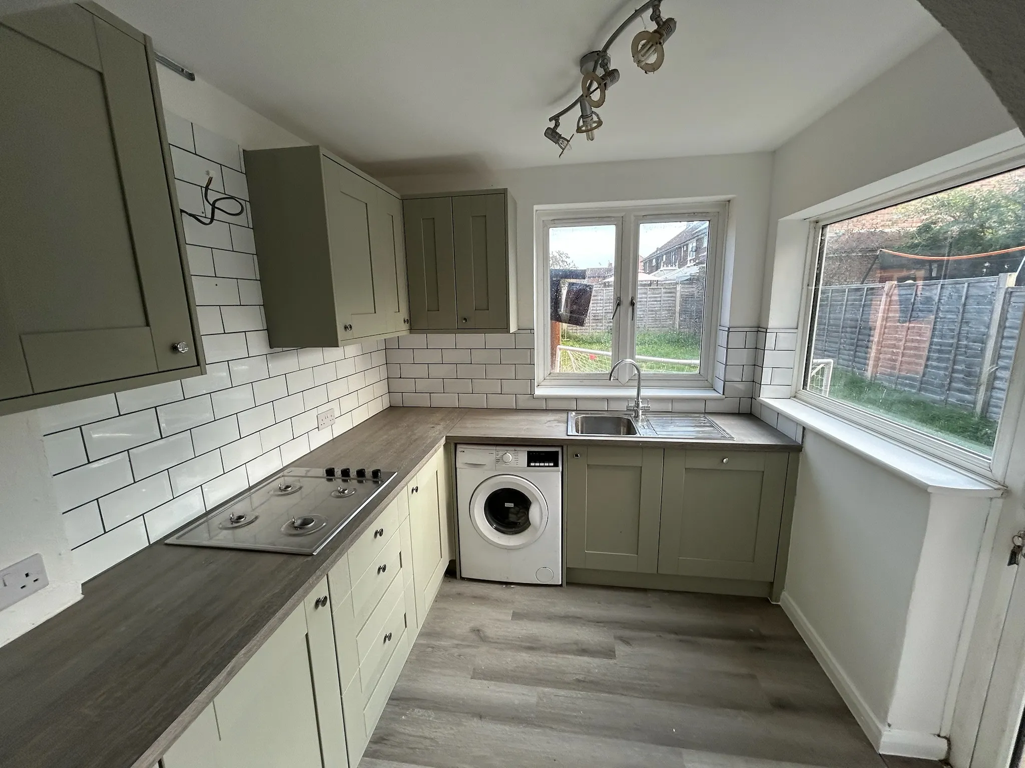 New kitchen with white tiling