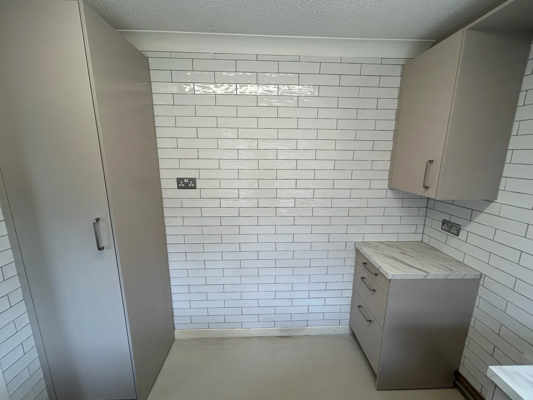 White tiled kitchen walls