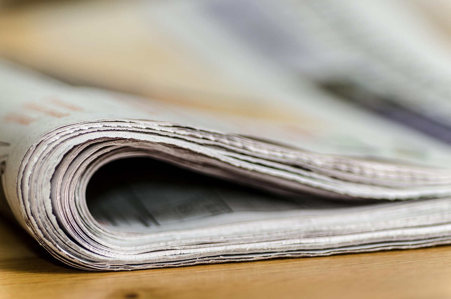 Newspaper laying on a desk