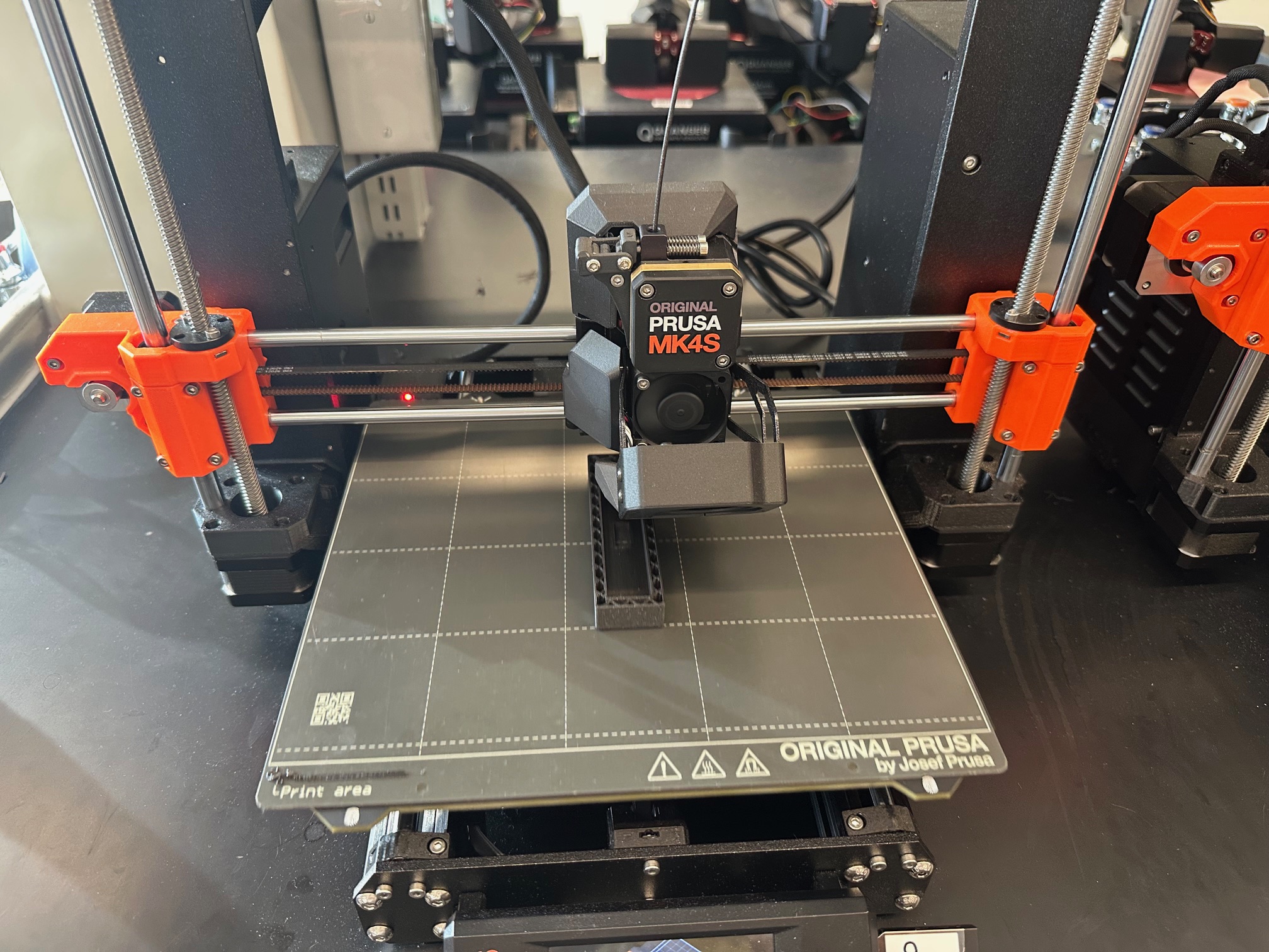 Prusa MK4S 3D printer producing the Lift Locker parts