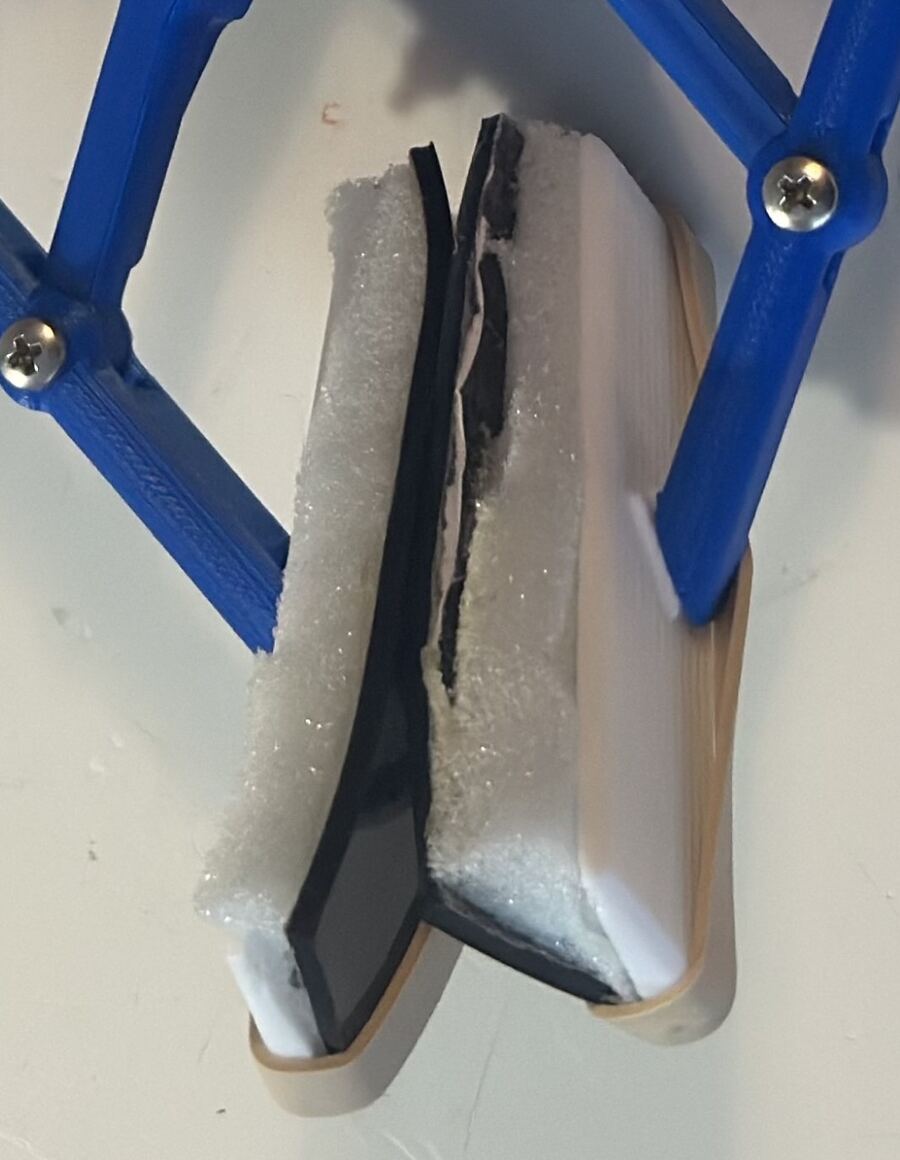 Gripper materials including rubber tape, memory foam, and rubber bands