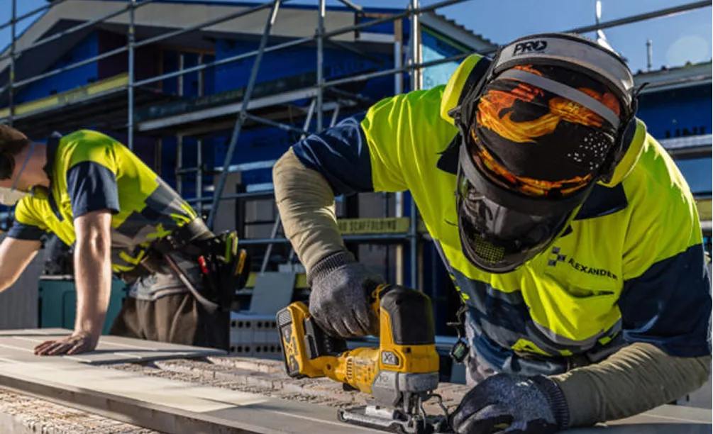 Alexander construction builders in hi-vis jackets