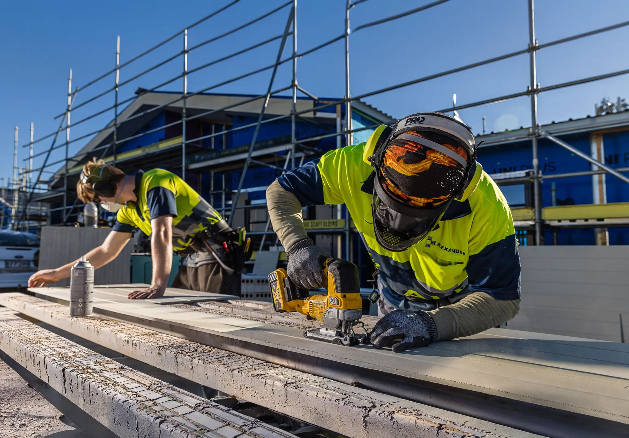 Alexander construction builders in hi-vis jackets