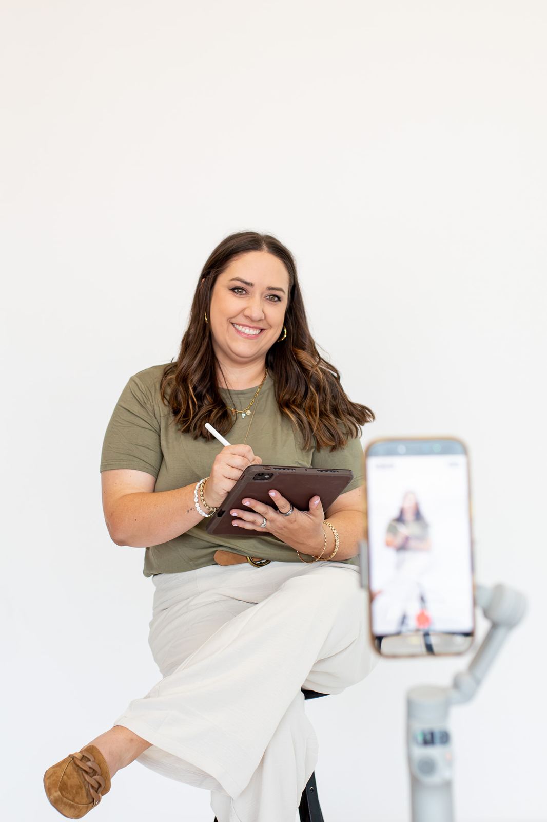 Flourish founder reviewing an audit on a tablet