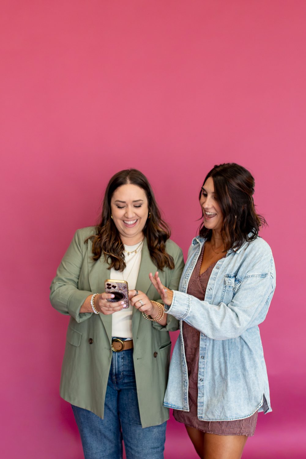 Brenna and Emily reviewing a client shoot together