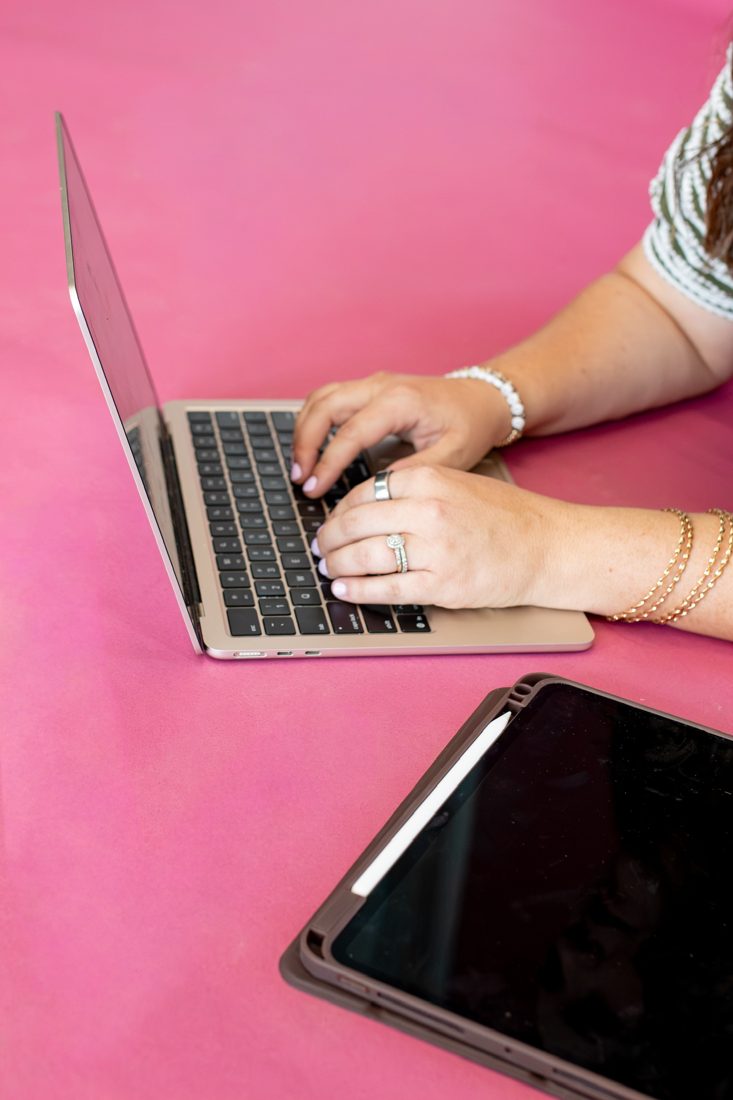 Detail of the team editing on laptop and tablet