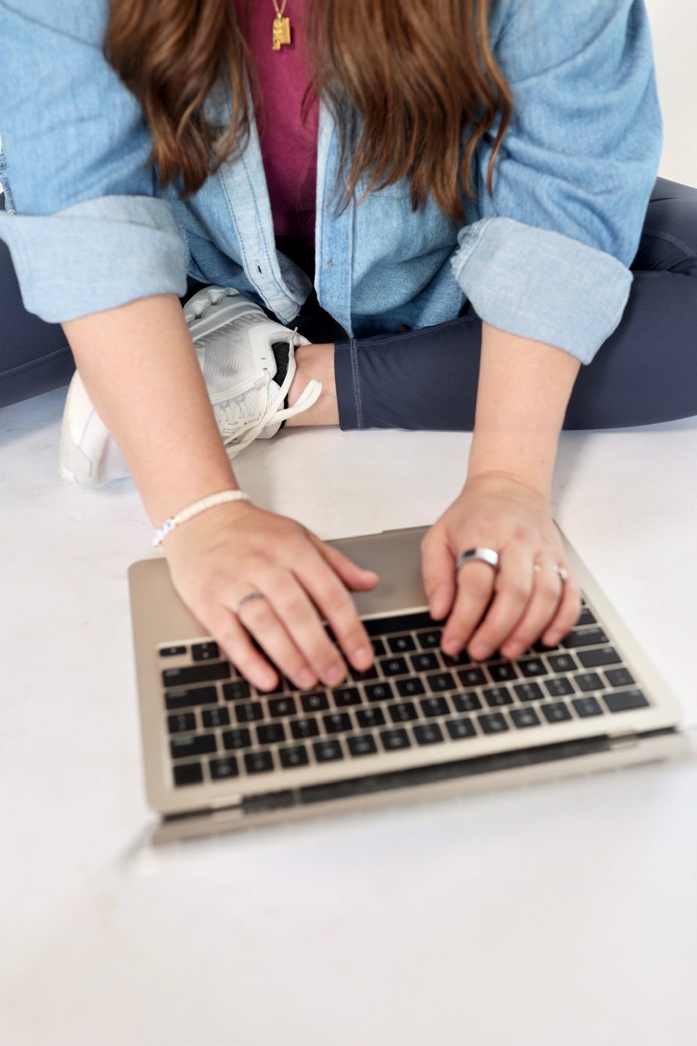 Hands building the system on a laptop