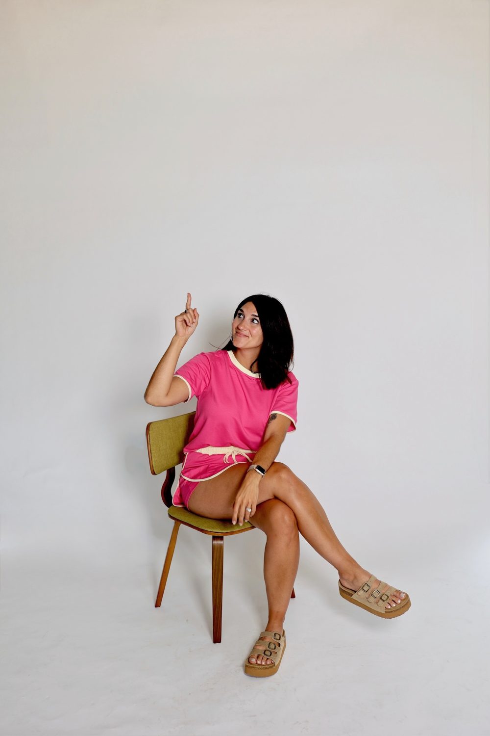 Brenna in the pink chair, studio set