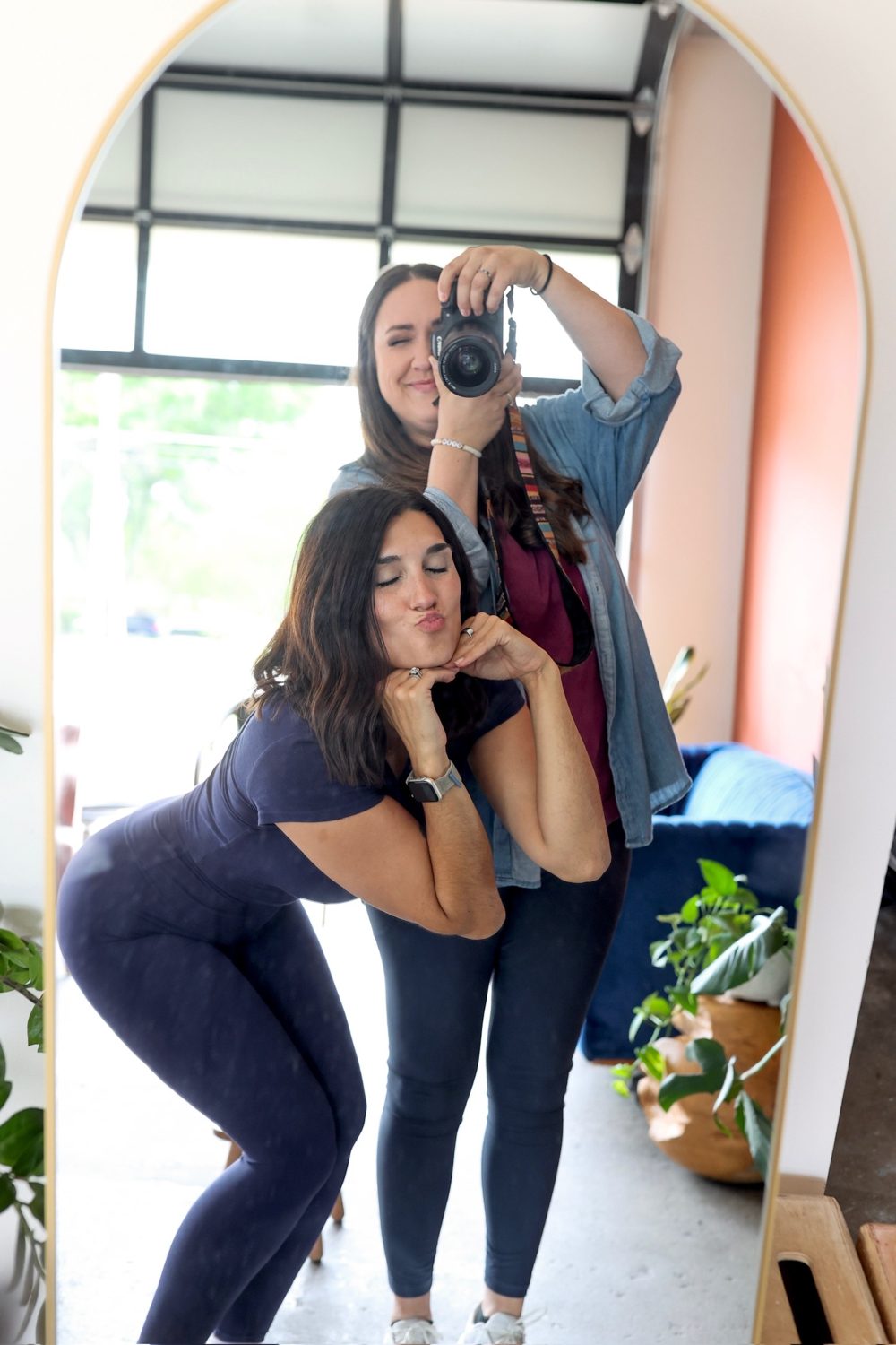 Laughing through a piggyback moment on set