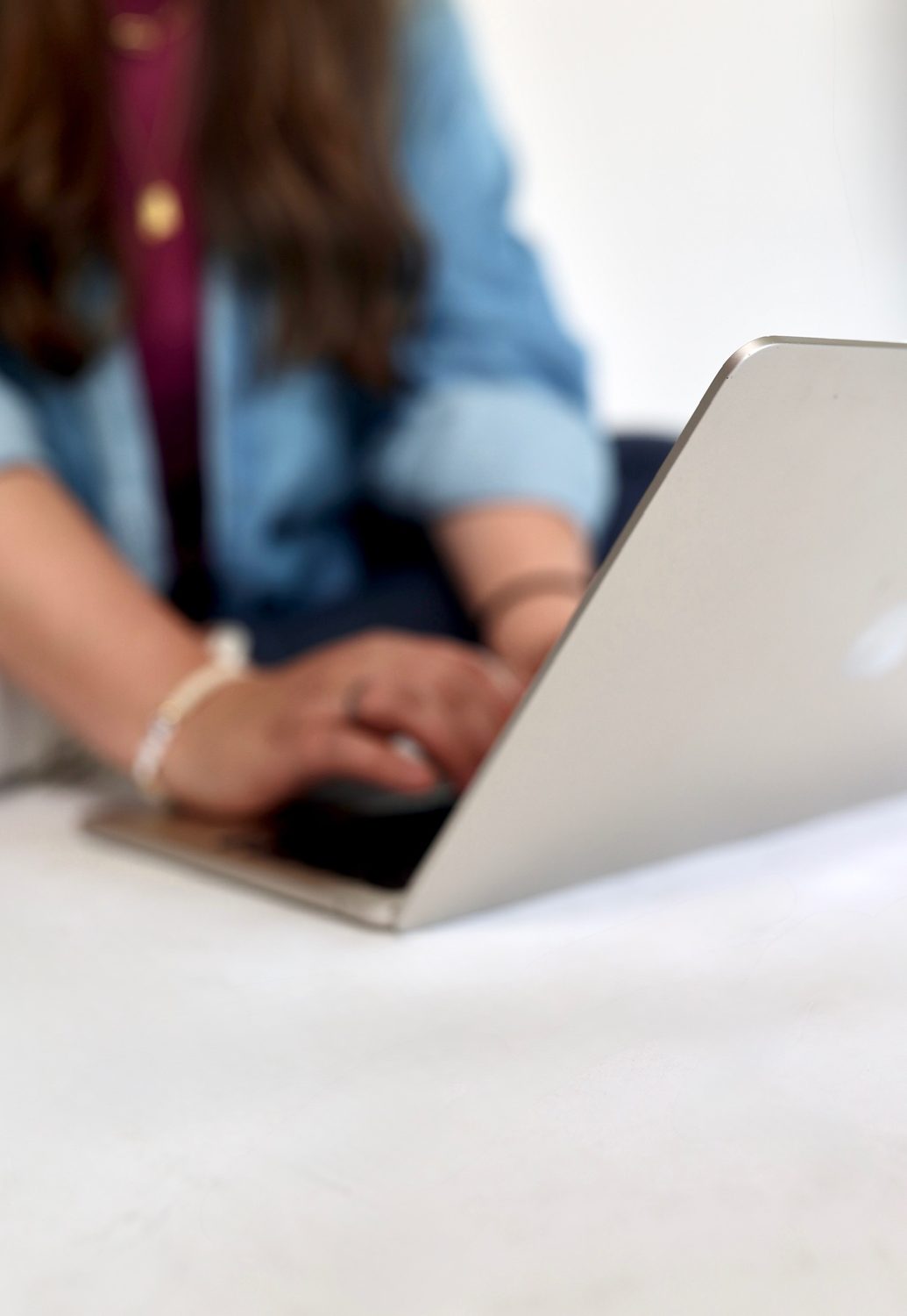 Typing on the laptop, overhead view