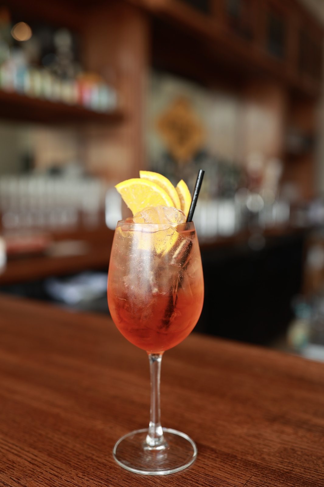 A cocktail on the bar at a restaurant client