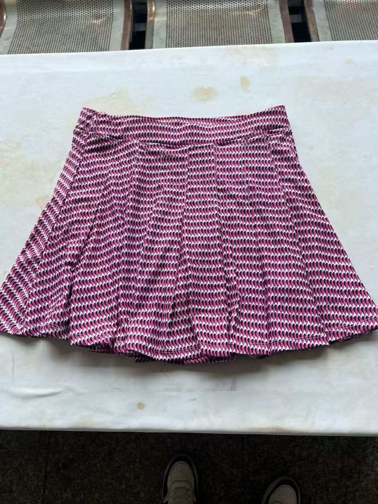 Front view of Hot Pink Ladies' Skort in wholesale ready stock (Style No. TF9143)