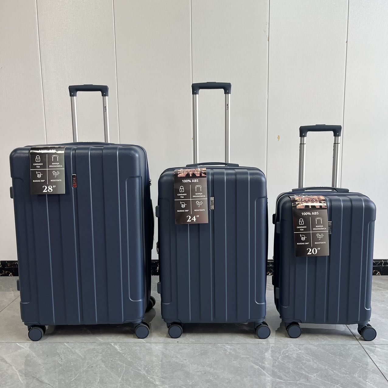 Blue 3-piece hard-shell trolley suitcase set displayed outdoors