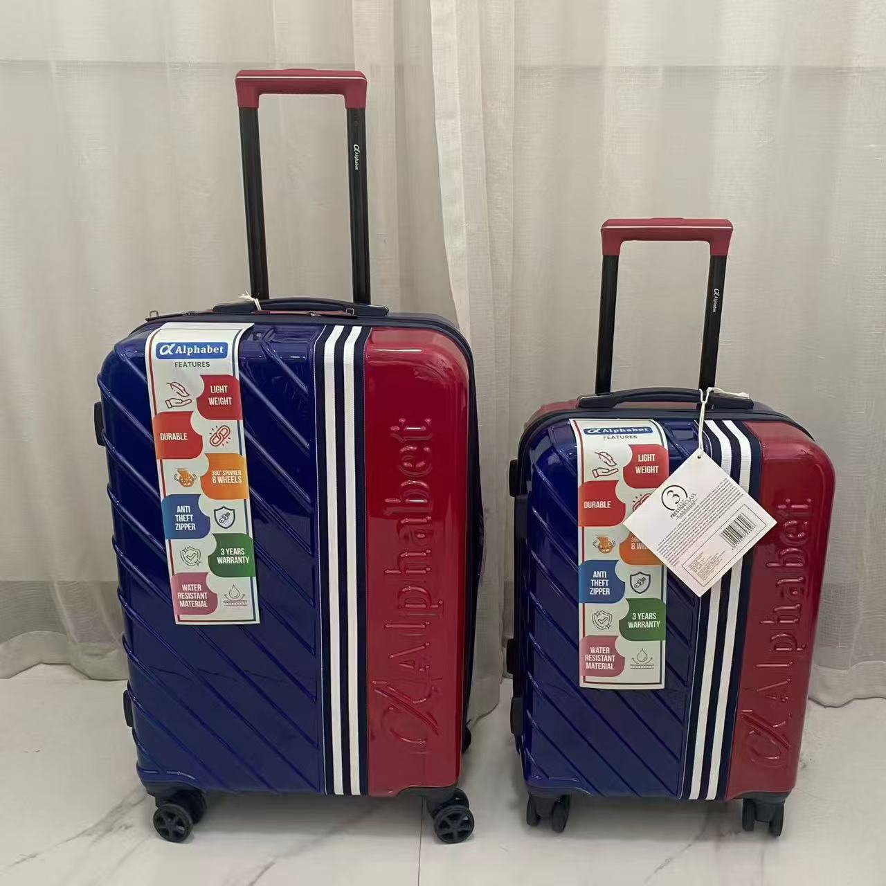 Red yellow and orange hard-shell trolley suitcases displayed together