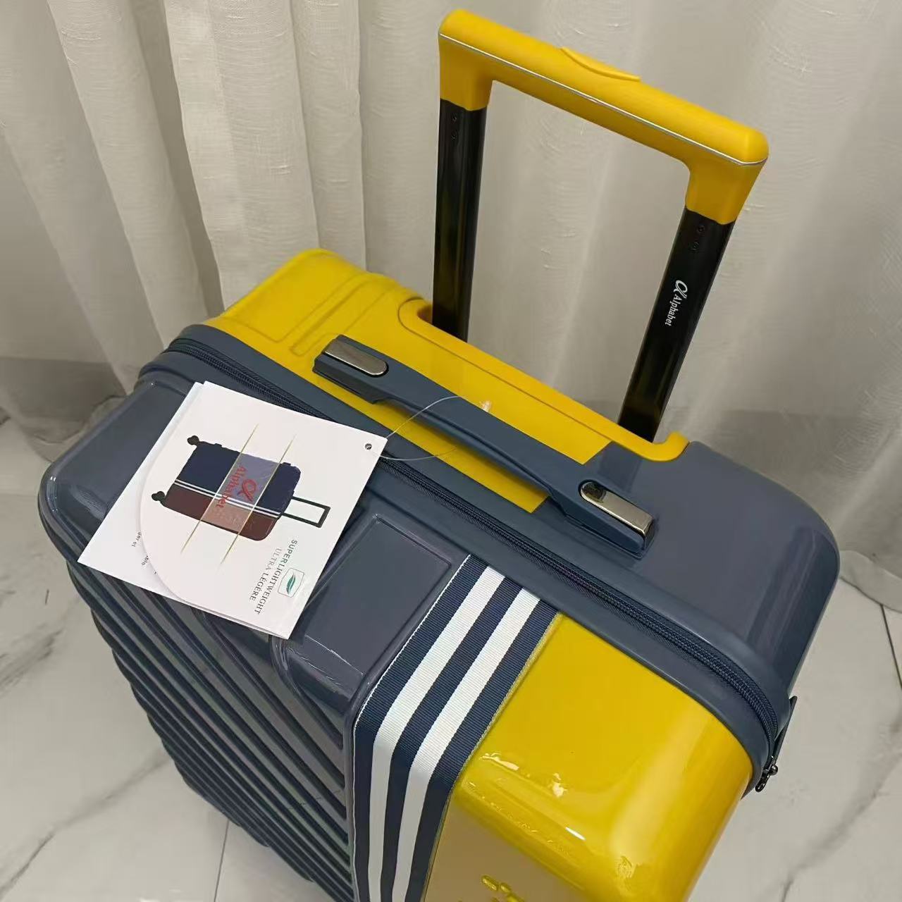 Close-up view of suitcase telescopic handle mechanism and top corner