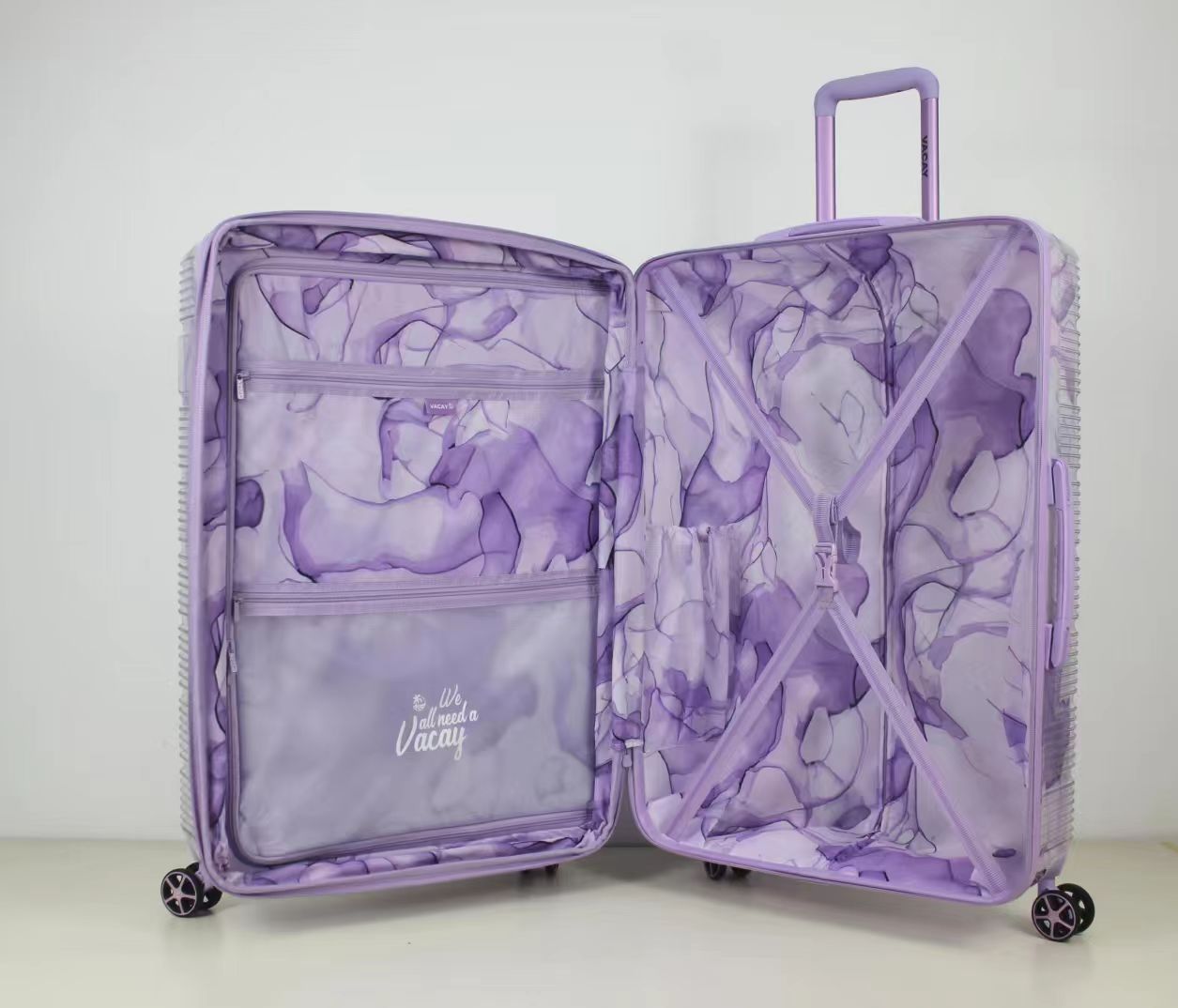 Front view of purple patterned 2-piece trolley luggage set