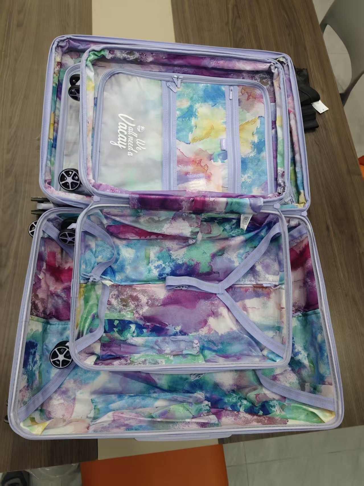 Close-up detail of patterned trolley luggage in shipping box