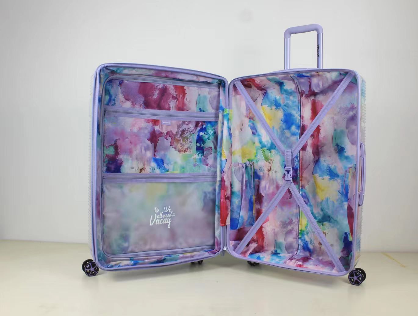 Front view of purple marble patterned 2-piece spinner luggage set