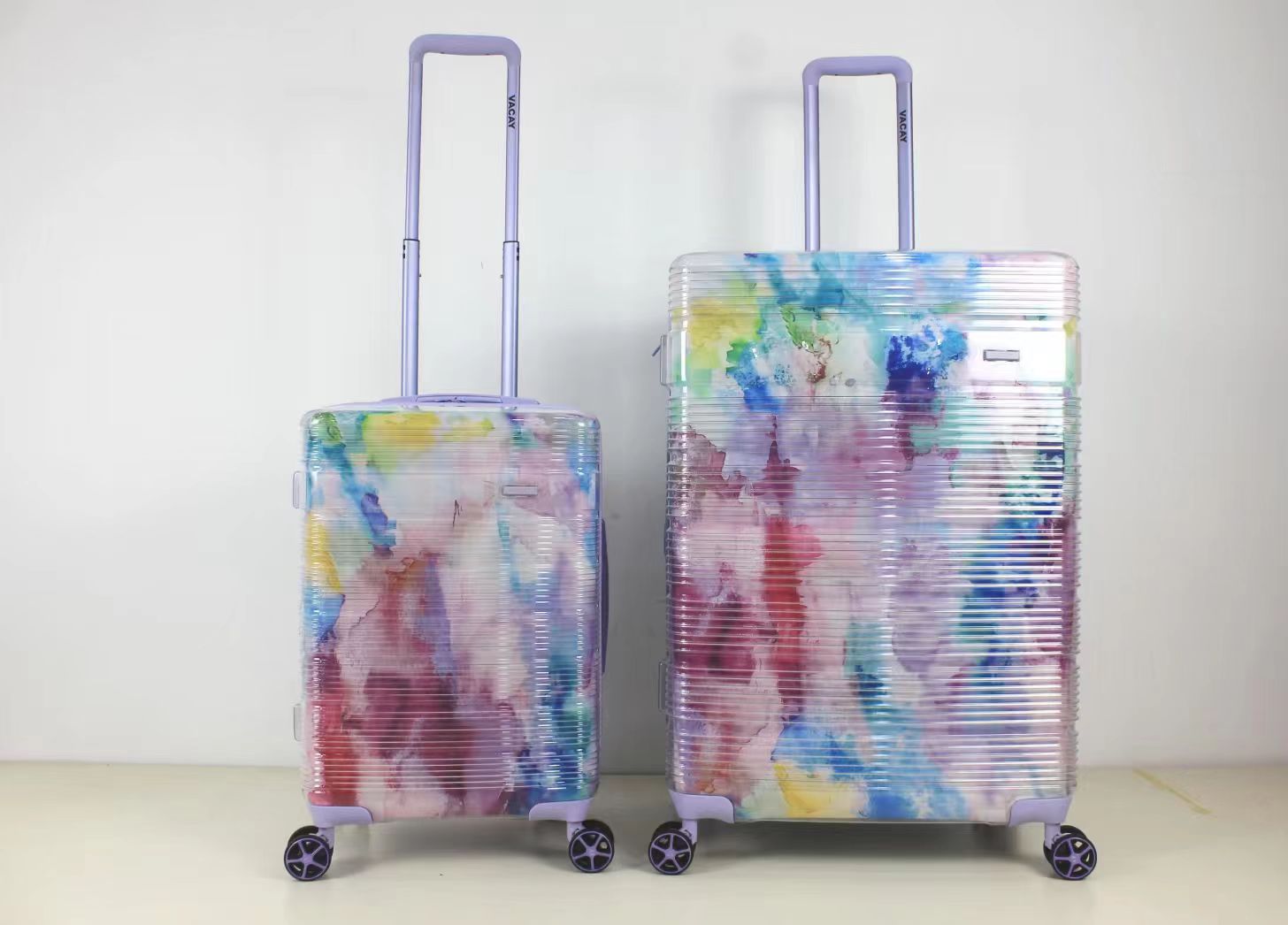 Front view of colorful rainbow patterned 2-piece trolley case set