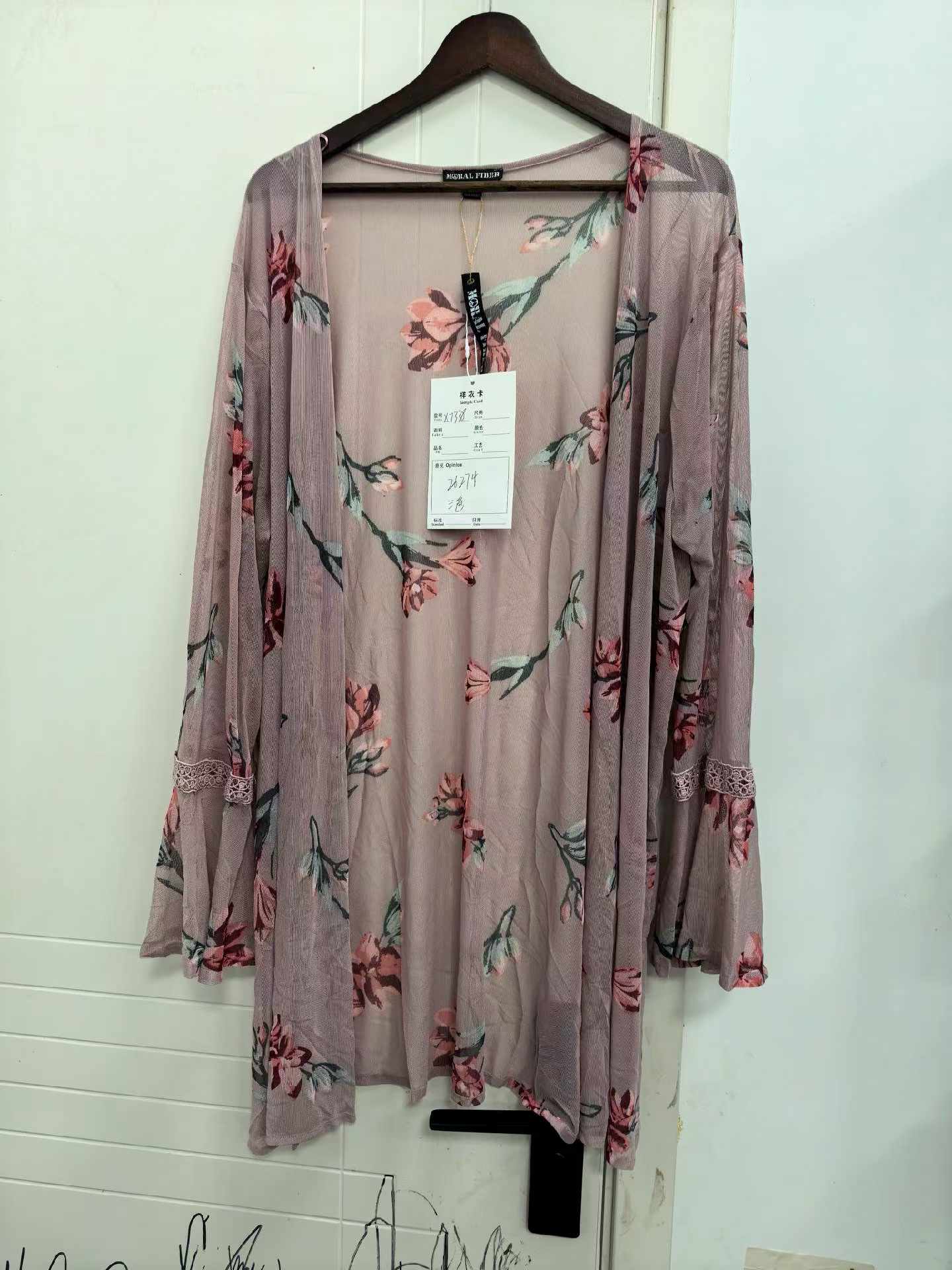 Ladies' floral print kimono cardigan displayed on a mannequin