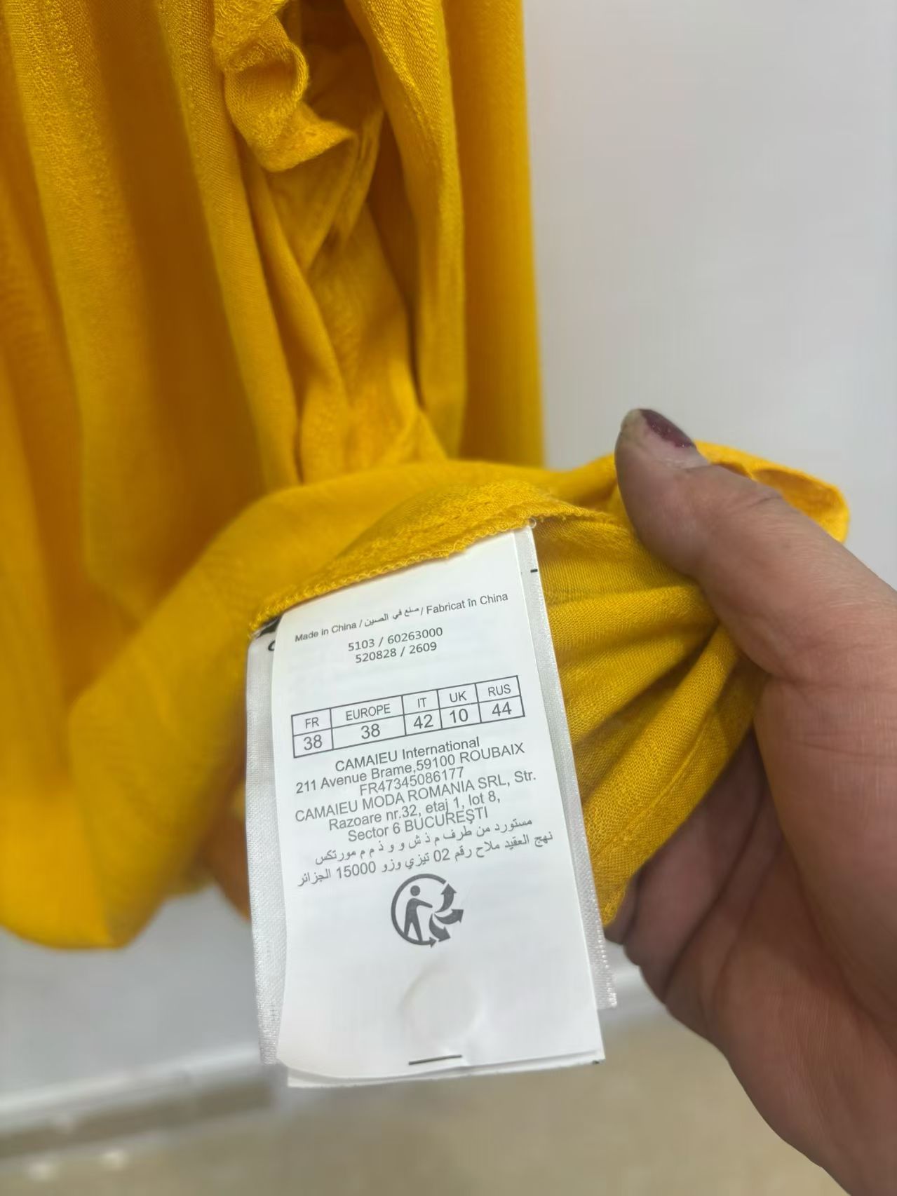 Model wearing mustard yellow ladies' long sleeve blouse