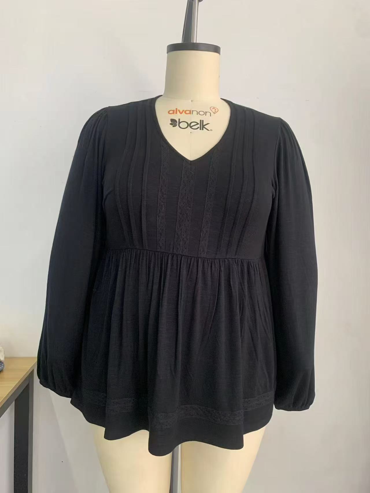 Black ladies' long sleeve rayon blend blouse displayed on a mannequin