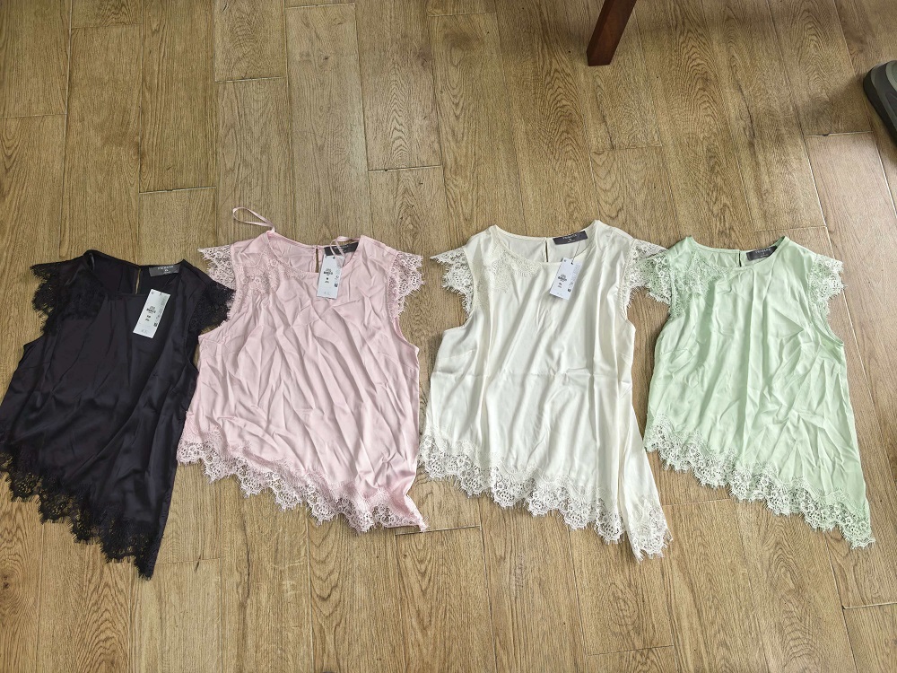 Ladies' short sleeve blouses displayed in four different colors