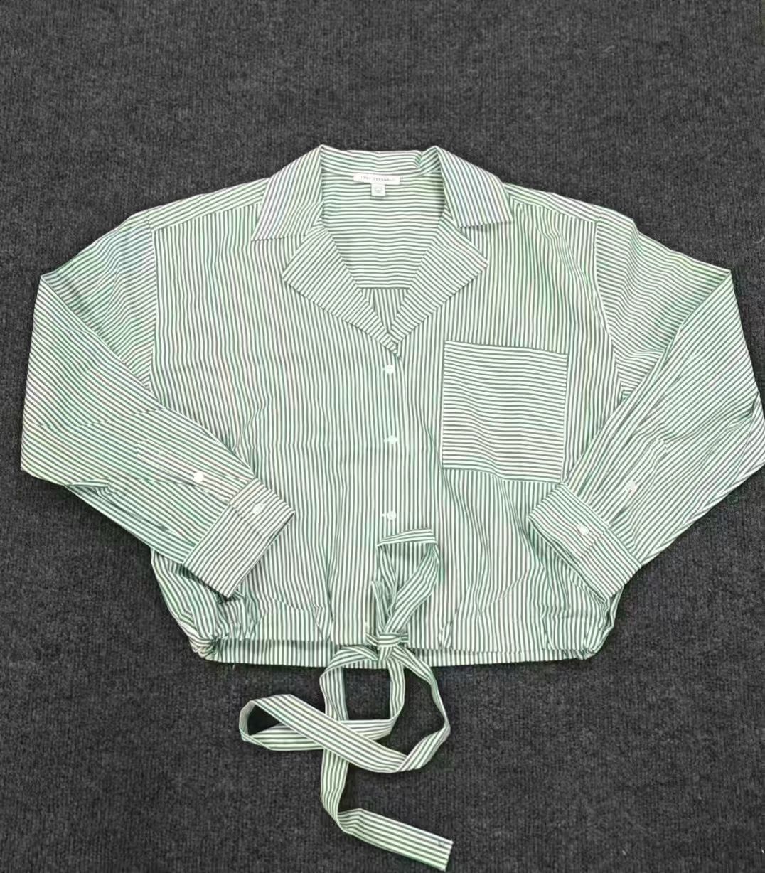 Light blue striped ladies' cotton blouse displayed flat