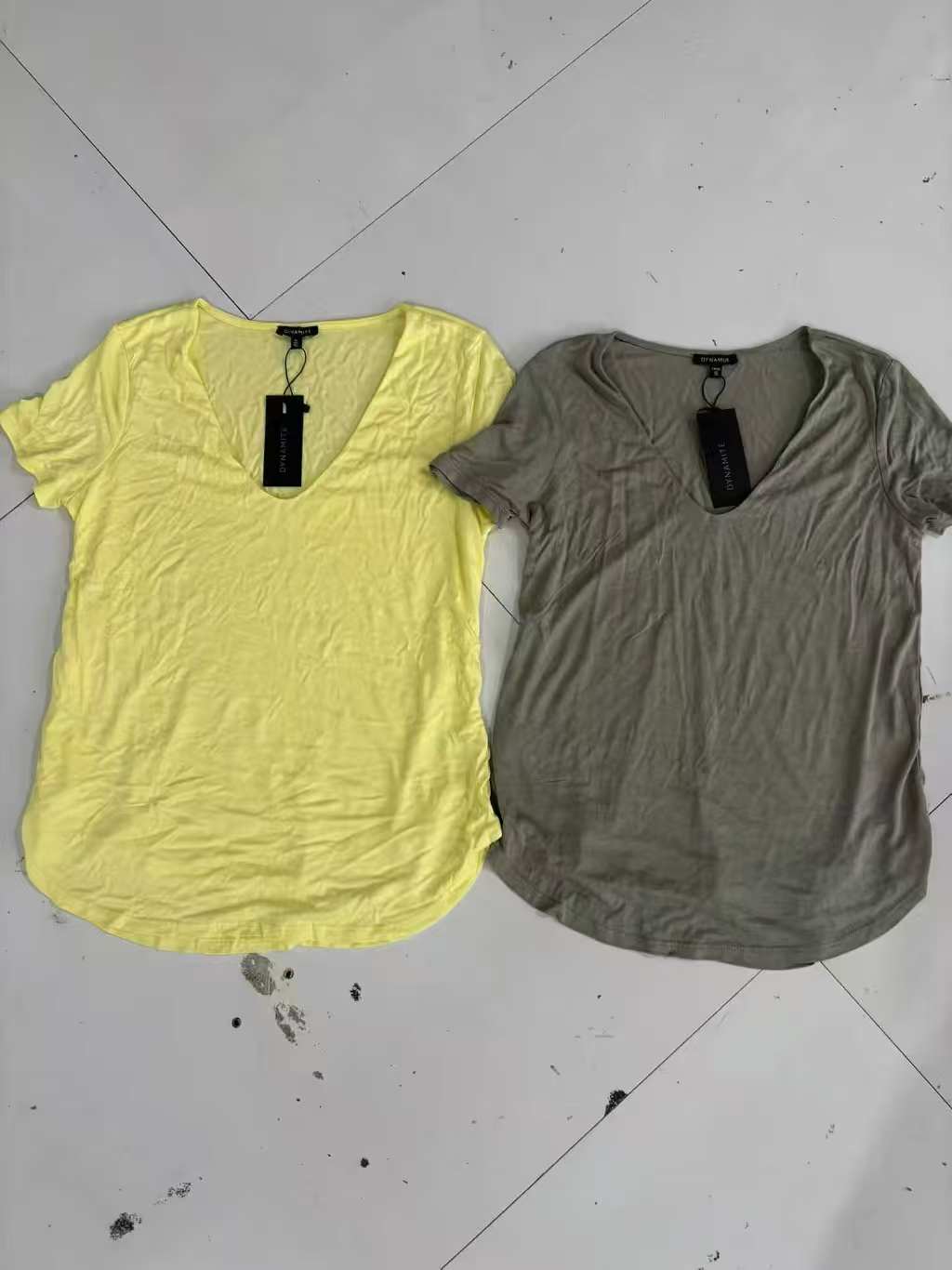 Yellow ladies' short sleeve blouse displayed flat